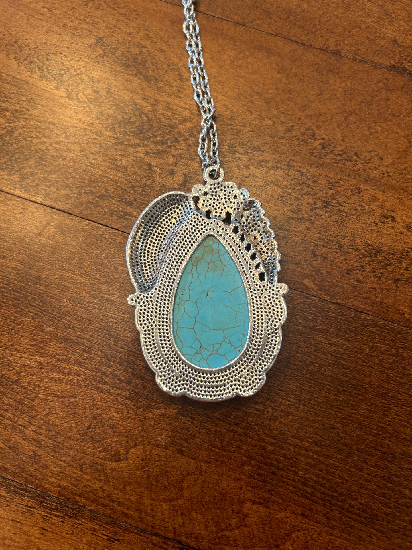 Turquoise Stone in a Long Chained Silver Necklace