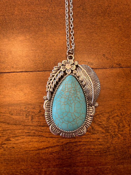 Turquoise Stone in a Long Chained Silver Necklace